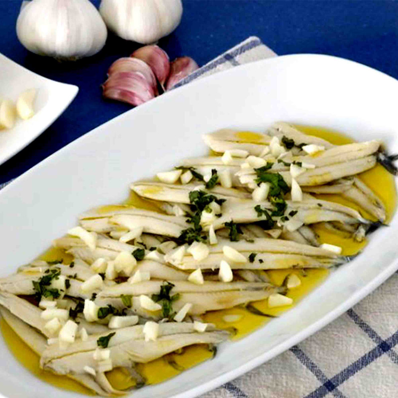 Boquerones, White Anchovies in Vinegar drizzled in olive oil
